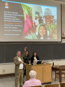 Ken Cameron, Patty Chan and Bing Li stand at the lectern